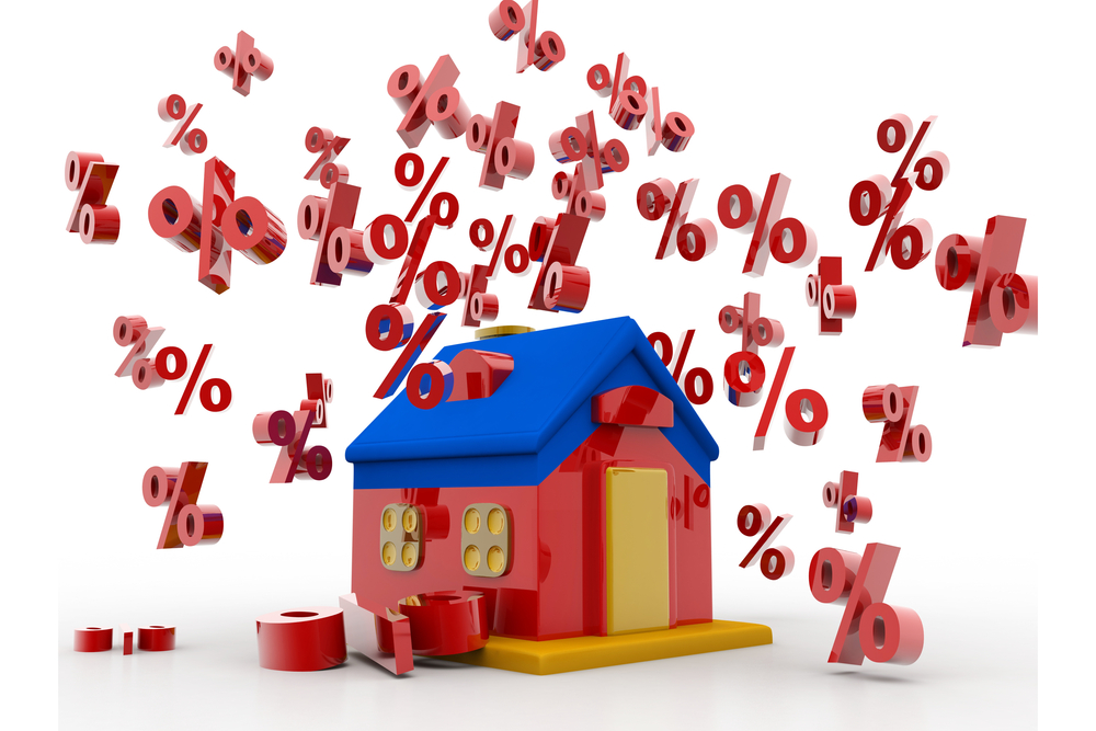 Percentage symbols tumble around a house